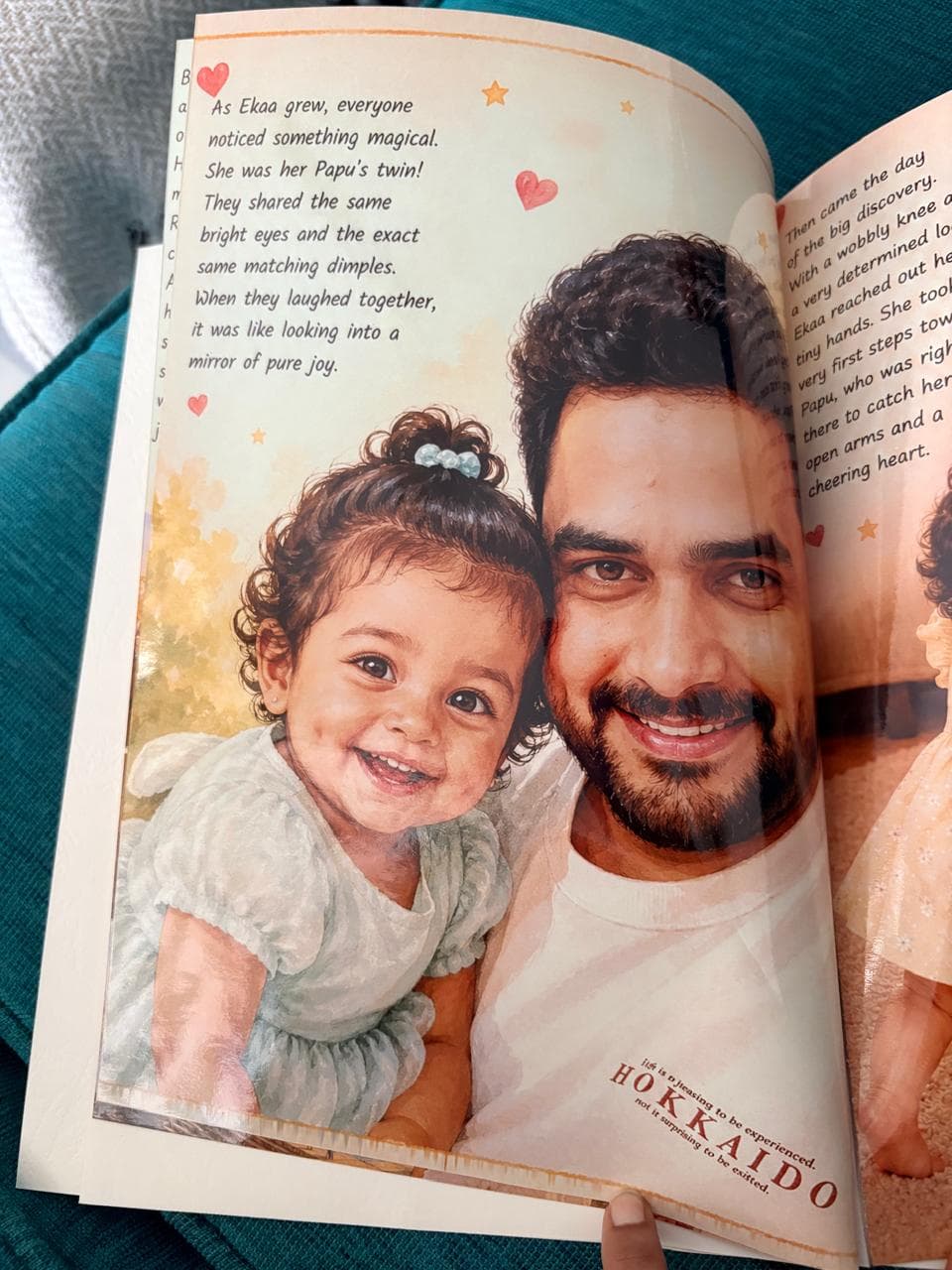 A page from a custom book showing a smiling toddler cheek-to-cheek with her father.